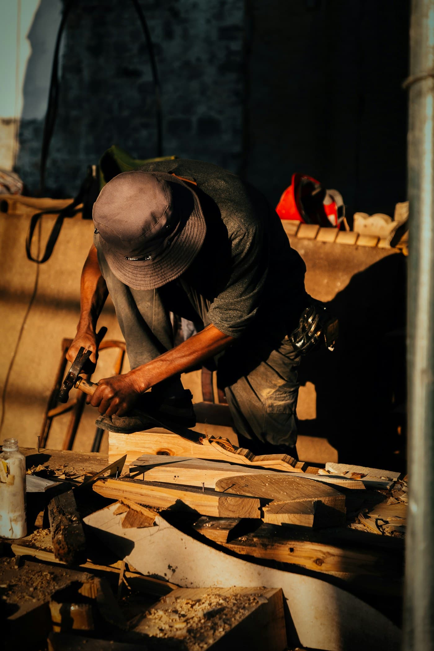 A craftsperson working with timber in a workshop